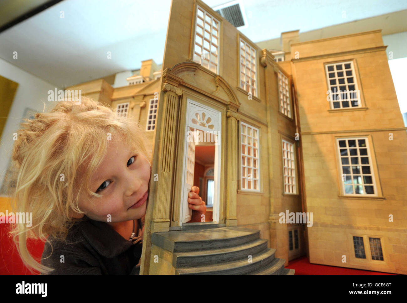 Emilia Hampton, who celebrated her 6th birthday today, with a 1:12th scale doll's house, modelled on Bourton House. The 24-room doll's house, which replicates the lavish interior of the celebrated country manor, is expected to fetch up to 3,000 at auction. Stock Photo