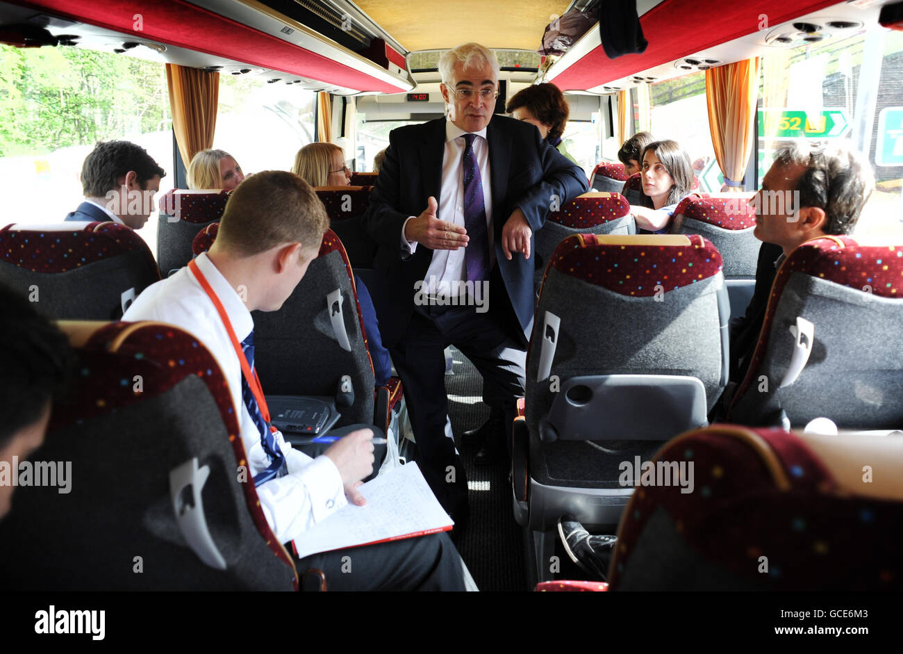 Chancellor Alistair Darling talks to reporters on the Labour Party campaign press bus in Derbyshire. Stock Photo