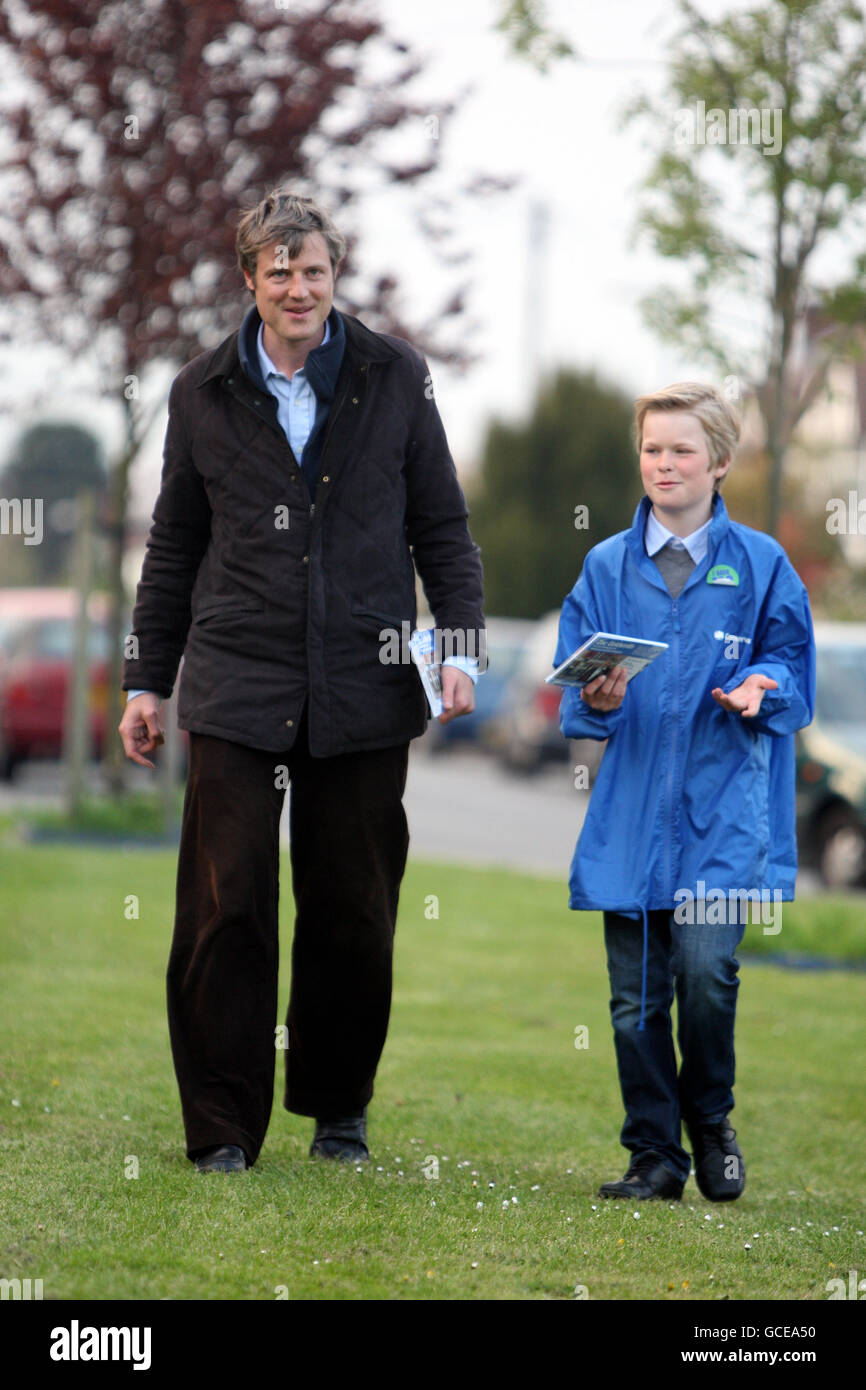 Conservative parliamentary candidate Zac Goldsmith campaigns with the help of William Liefting Moore aged 10, in Tudor near Kingston upon Thames, south west London, ahead of the General Election on May 6. Stock Photo