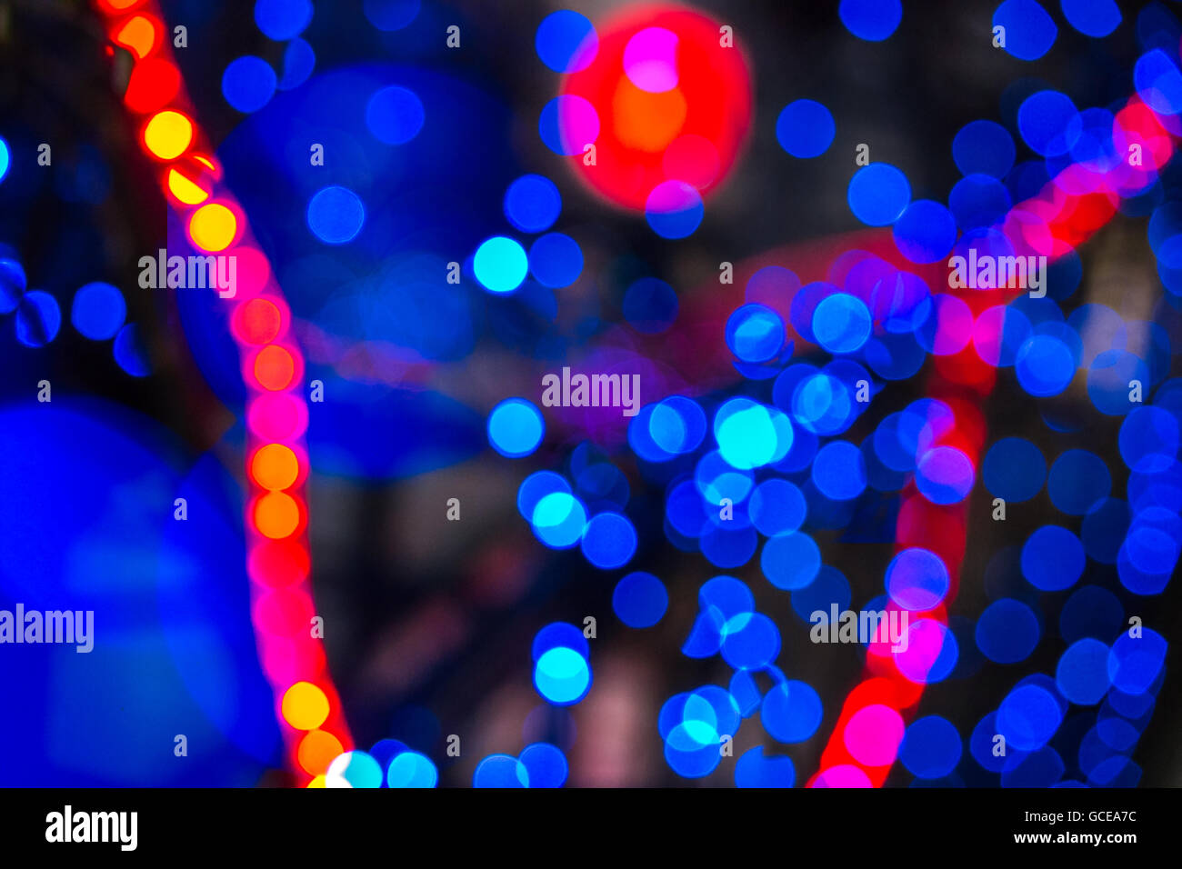 Abstract Background Of Blurred Warm Red And Cool Blue Lights With