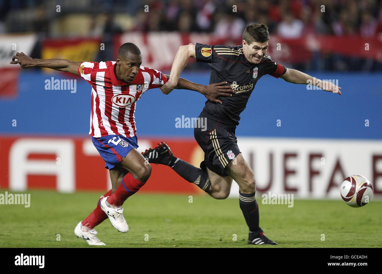 Atletico Madrid's Luis Amaranto Perea (left) and Liverpool's Steven Gerrard (right) battle for the ball Stock Photo