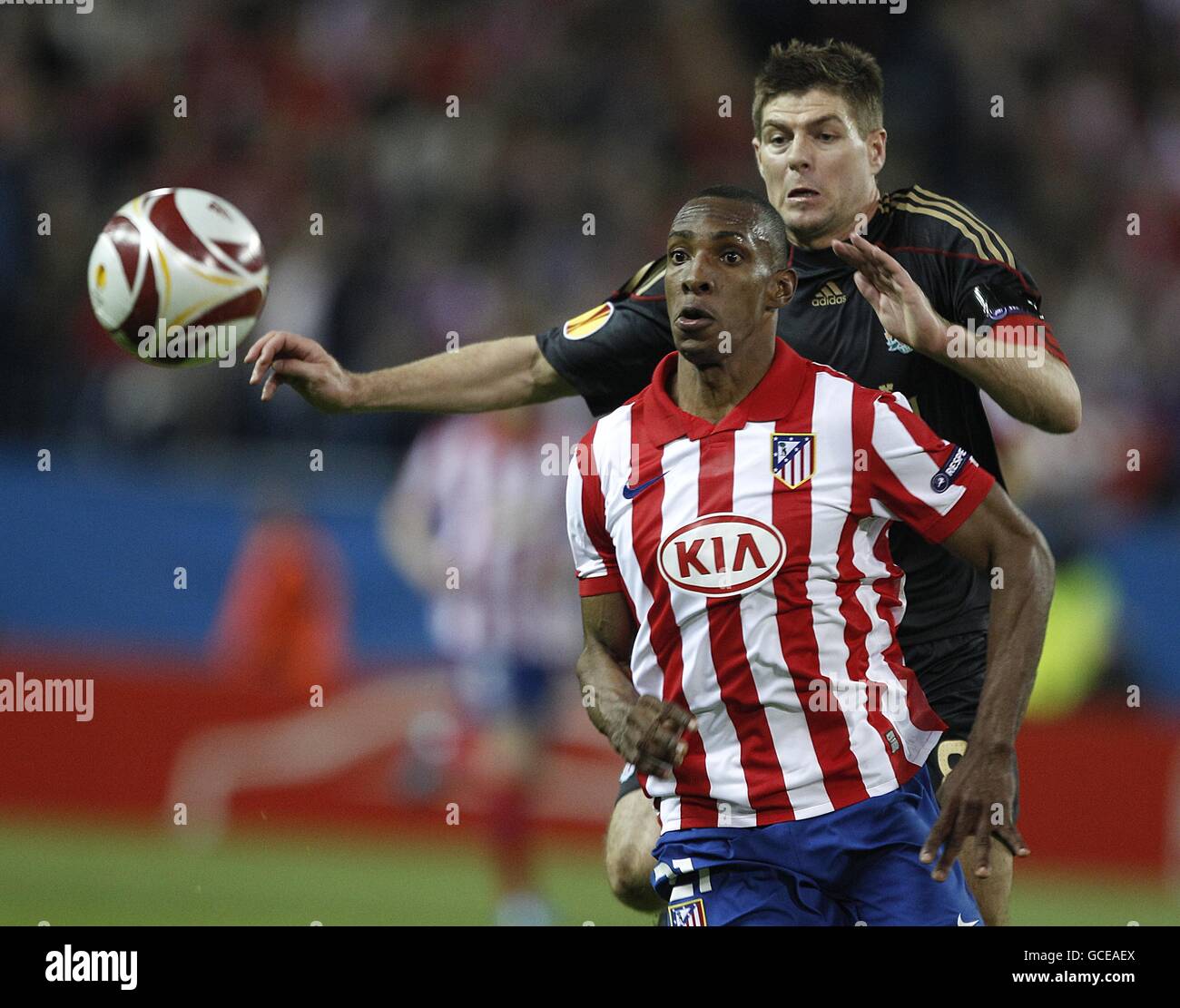 Atletico Madrid's Luis Amaranto Perea (left) and Liverpool's Steven Gerrard (right) in action Stock Photo