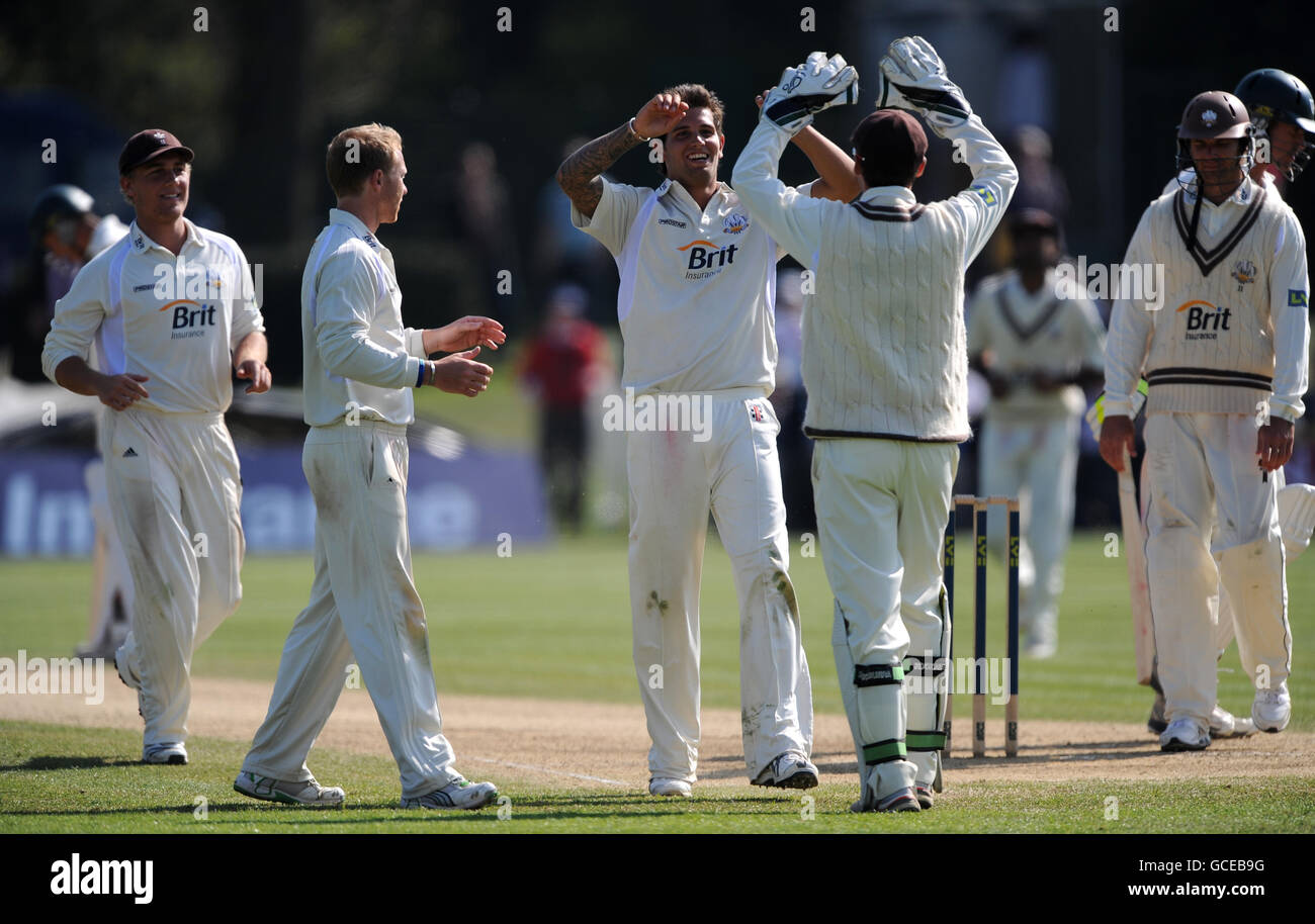 Surrey's Jade Dernbach celebrates with Steven Davies after taking the wicket of Worcestershire's Jack Shantry Stock Photo