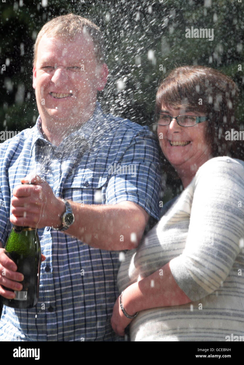 Robert McIntosh and his wife Susan from Aberdeenshire after winning 4,460,495 on the lottery on April 17 2010 celebrate in Aberdeen. Stock Photo