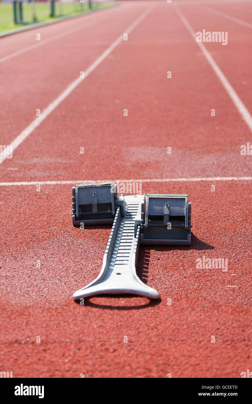 Athletic track. Athletics starting blocks (Shallow DOF Stock Photo Alamy