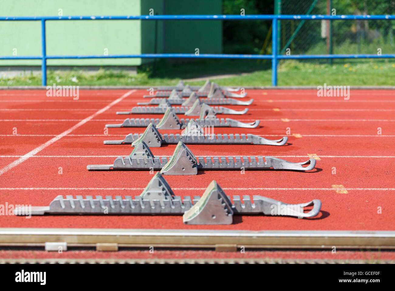 Athletic track. Athletics starting blocks (Shallow DOF Stock Photo Alamy