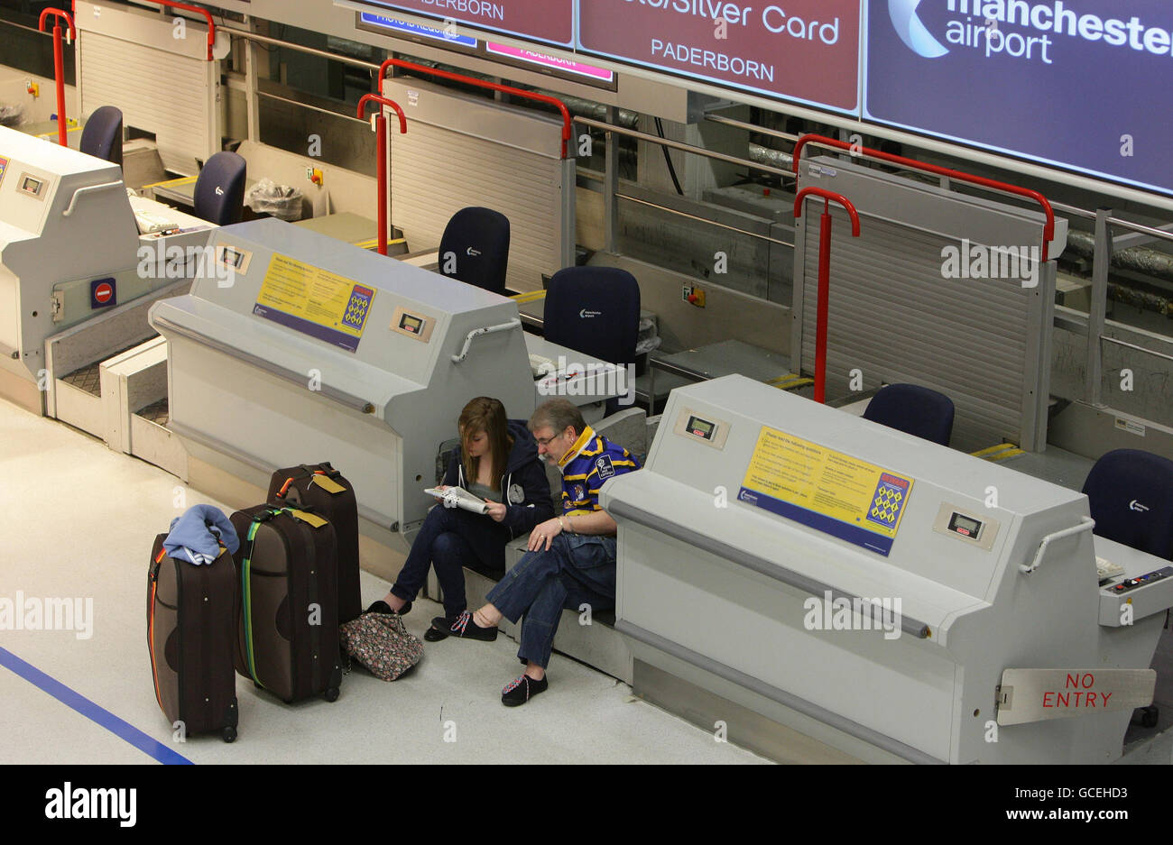 Passengers waiting in Terminal 1 at Manchester Airport, where flights
