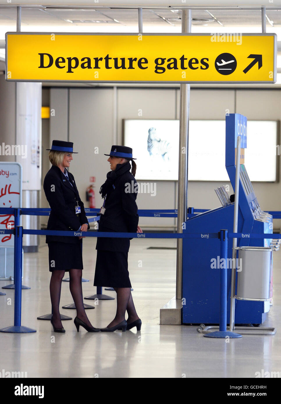 BMI staff at a closed check in desk at Edinburgh airport, where ash from a volcanic eruption in Iceland moving towards UK airspace, has caused mass travel disruption. Stock Photo