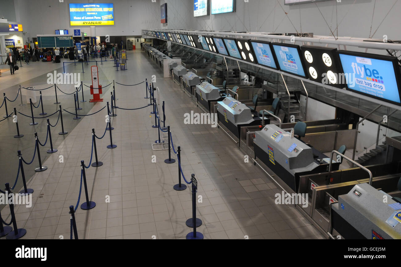 A deserted check-in area at Birmingham International Airport, where flights have been cancelled due to ash from a volcanic eruption in Iceland moving towards UK airspace. Stock Photo