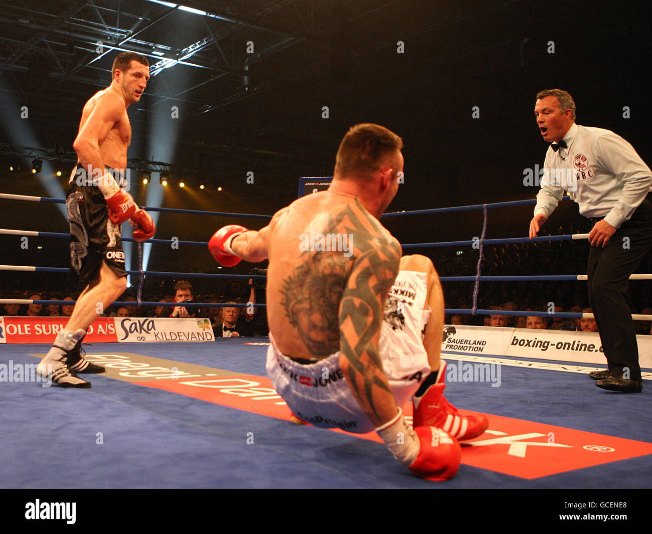 Mikkel Kessler (centre) goes down after a blow from Carl Froch during the WBC Super-middleweight title fight at the MCH Arena in Herning, Denmark. Stock Photo