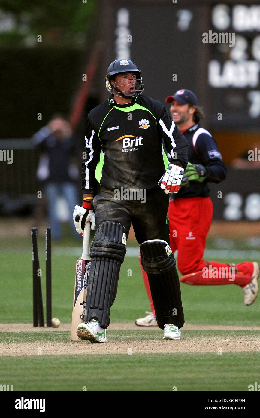 Surrey's Andre Nel shows his frustration as Lancashire celebrate taking his wicket Stock Photo