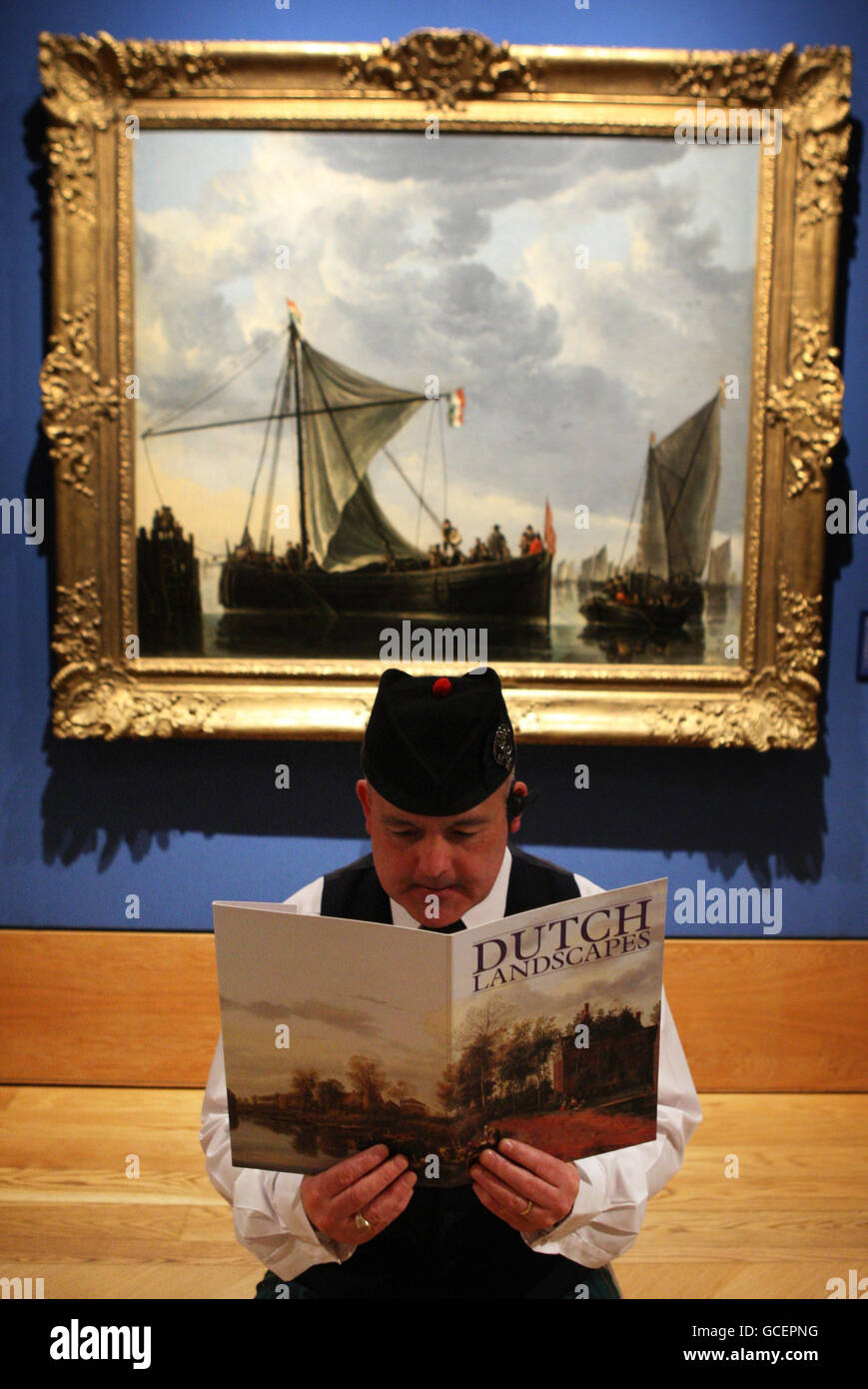 A member of gallery staff at the Dutch masterpieces exhibition where a total of 42 works from the Dutch 'Golden Age' will go on display during the Dutch Landscapes exhibition, which opens to the public on Friday at Holyroodhouse, Canongate, Scotland. Stock Photo
