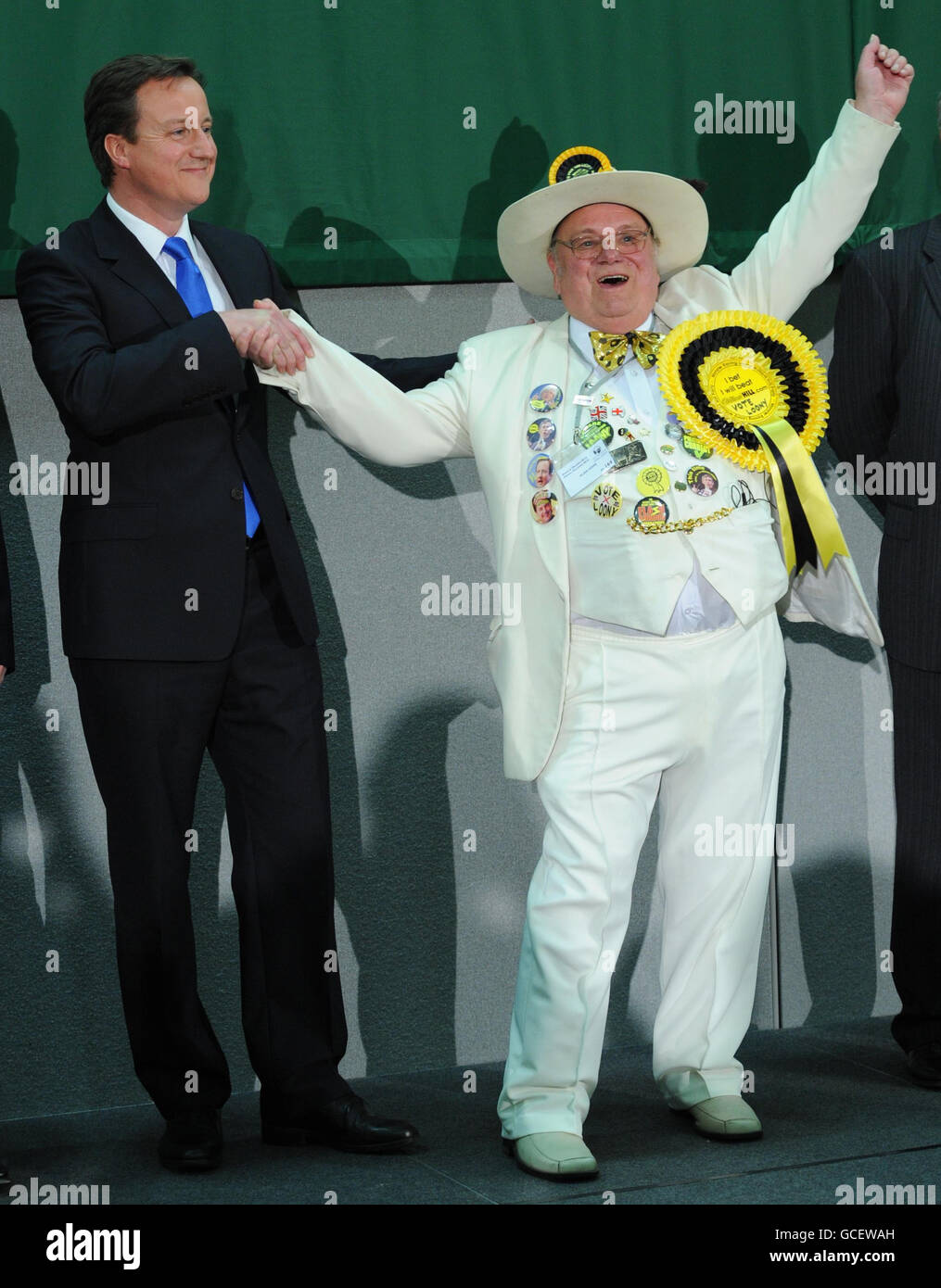 Conservative Party leader David Cameron celebrates winning his seat of Witney tonight with Monster Raving Loony William Hill Party candidate Alan Hope. Stock Photo