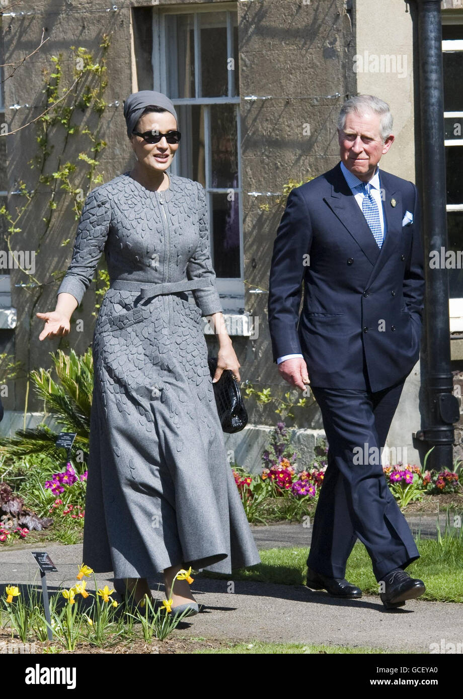 Consort of the Emir of Qatar, Sheikha Mozah bint Nasser Al Missned, is accompanied by the Prince of Wales during the opening of the Quranic Garden Exhibition at the Royal Botanic Gardens, Surrey. Stock Photo