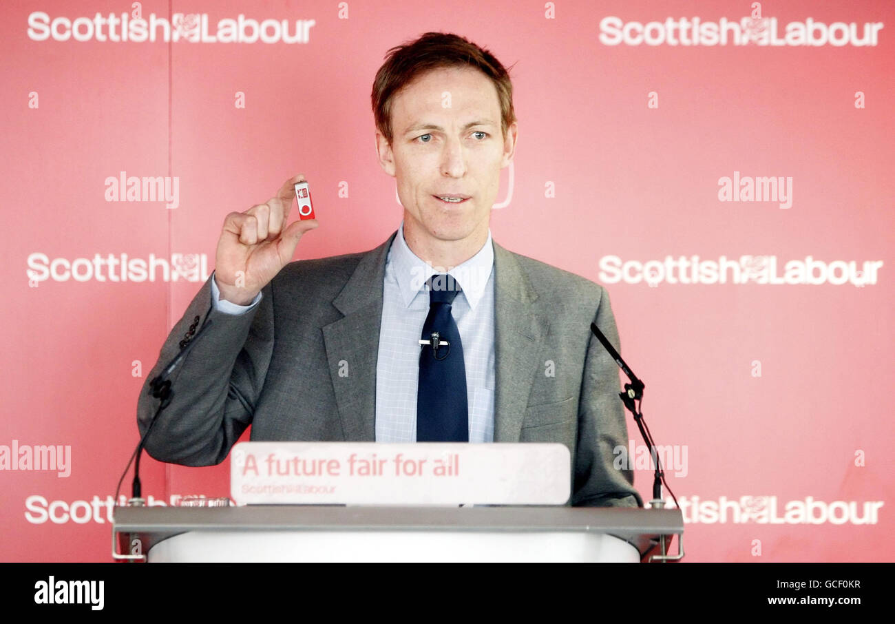 Scottish Secretary Jim Murphy holds a copy of Labour's manifesto for Scottish voters on a USB stick during the launch of Labour's manifesto for Scottish voters at Motherwell College in Scotland. Stock Photo