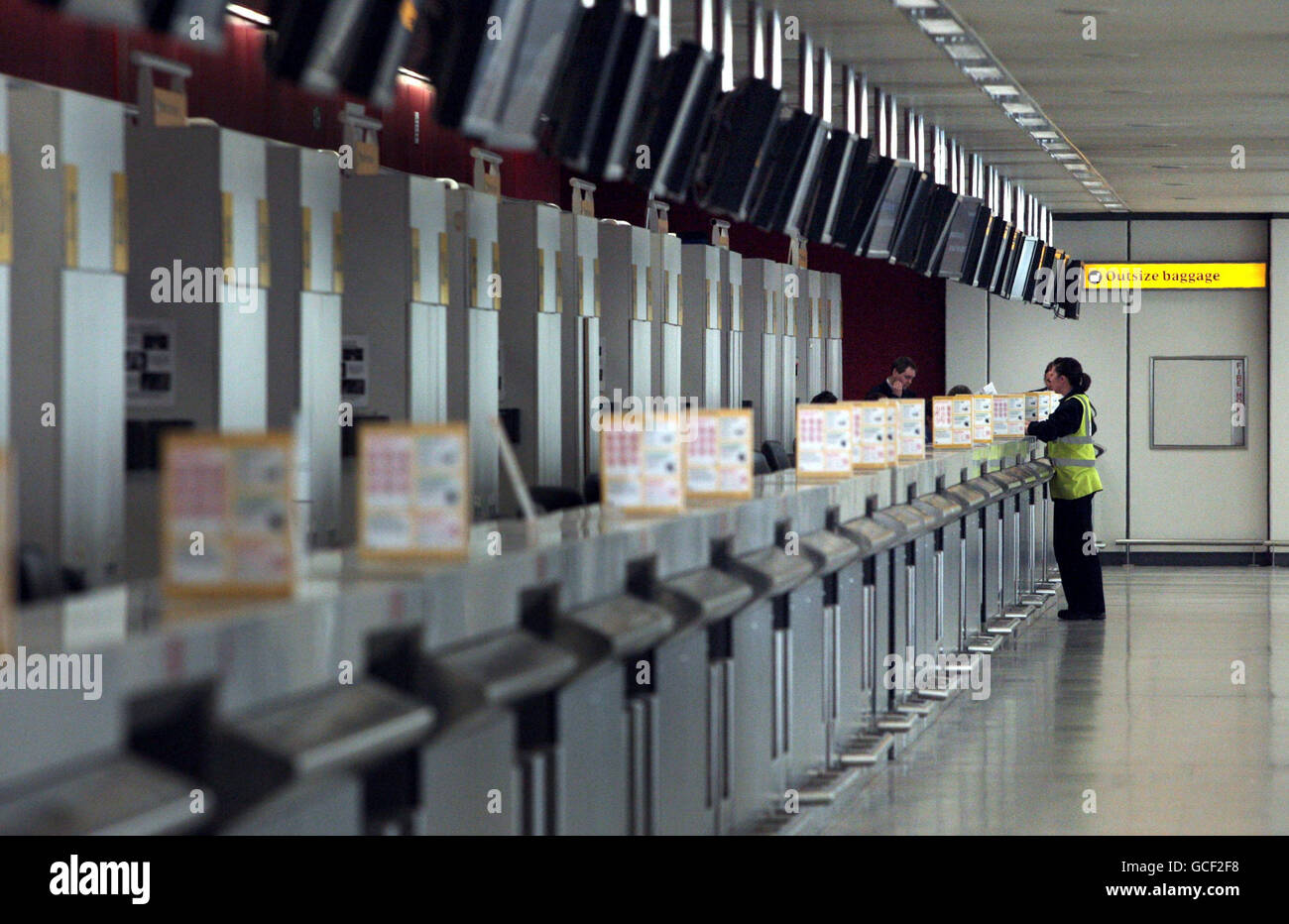 An empty check in desk at Edinburgh airport as Britain faced further ...