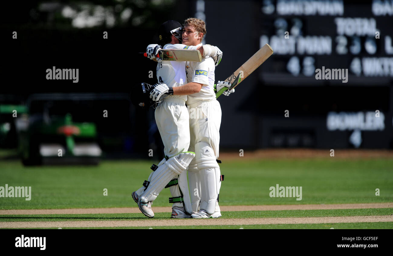 Surrey's Captain Rory Hamilton-Brown (right) is congratulated by Steven Davies (left) after reaching his century against Worcestershire. Stock Photo