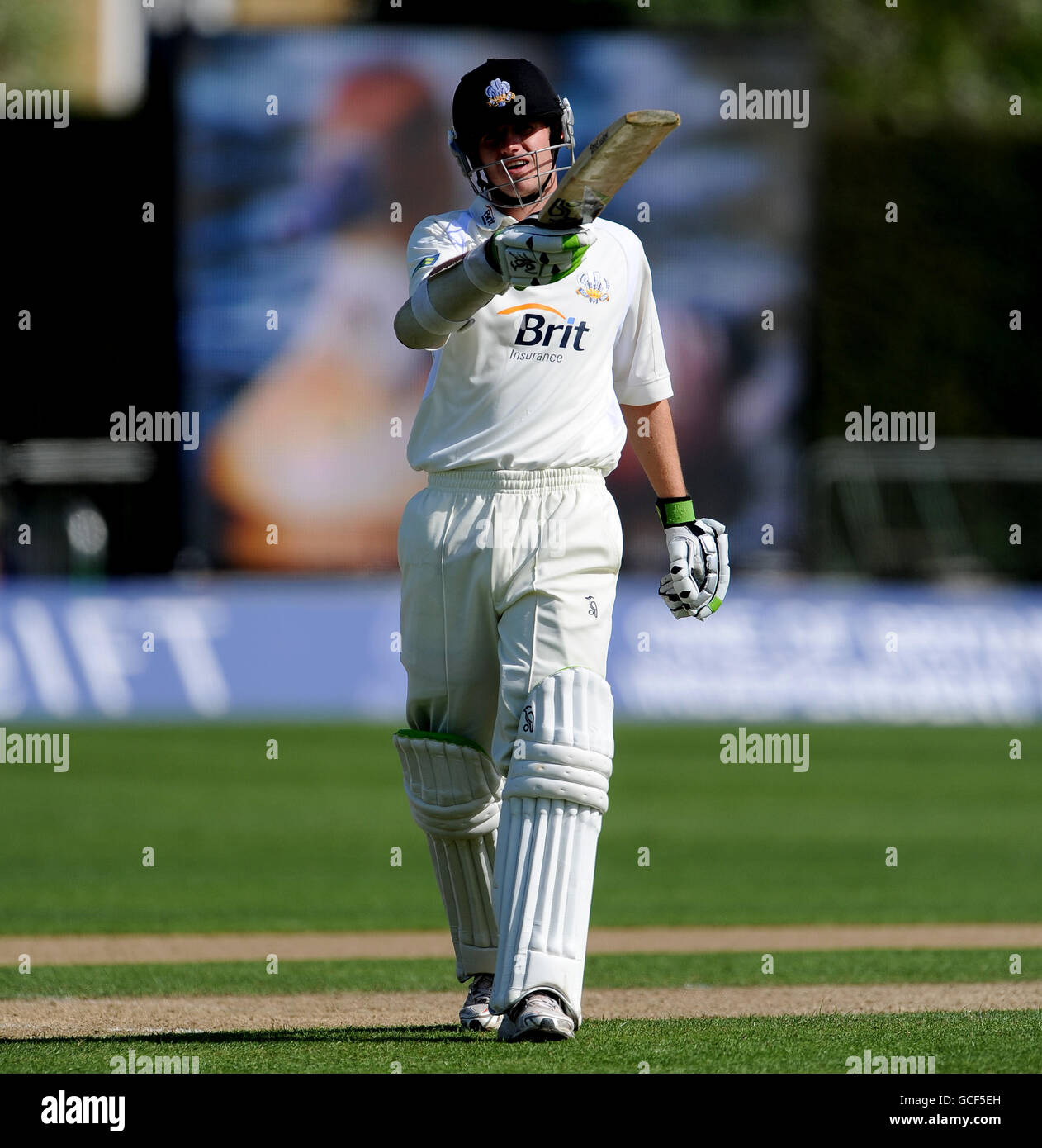 Surrey's Steven Davies points to the pavilion in celebration after reaching his 50 against Worcestershire. Stock Photo