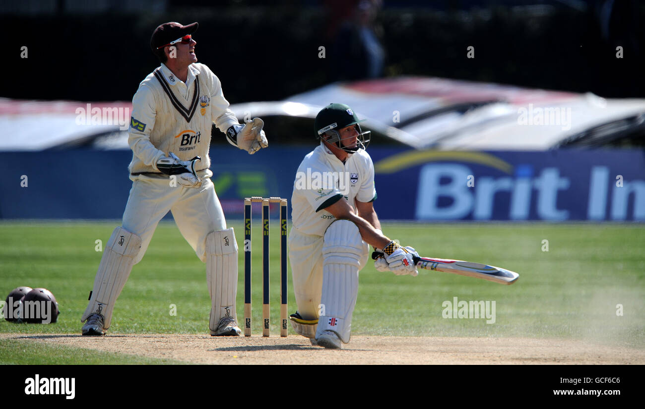 Surrey's Steven Davies looks on at Worcestershire's Ben Scott batting Stock Photo