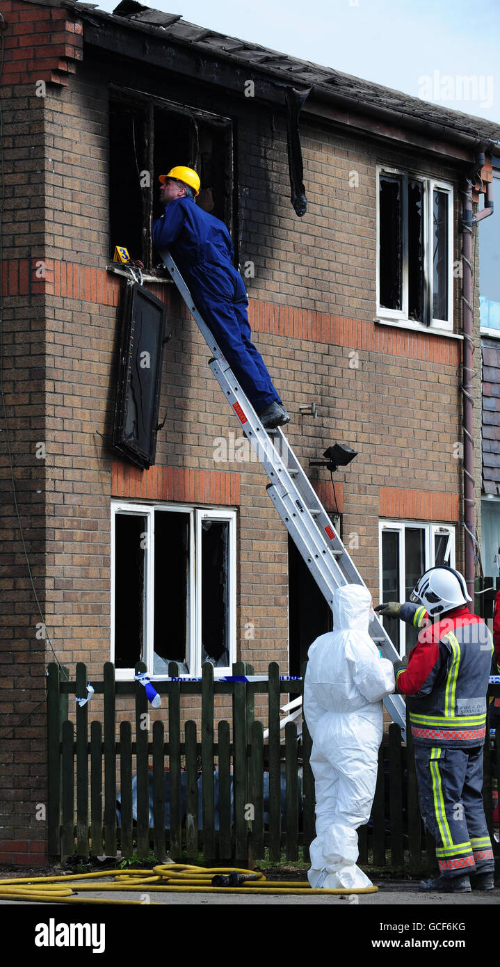 Emergency services attend the scene of a house fire in Buxton, Derbyshire, in which two young children died. Stock Photo