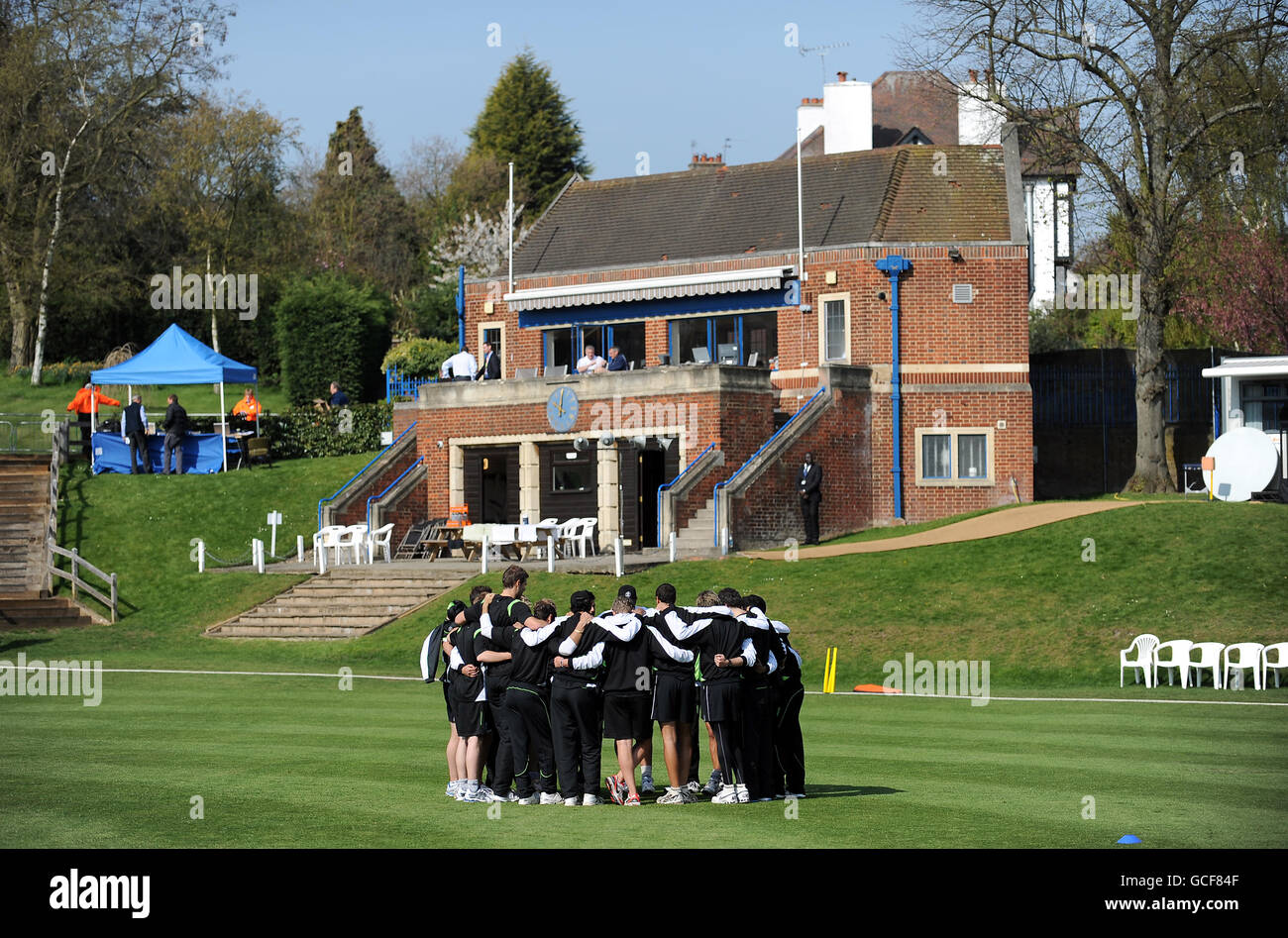 General view as Surrey form a team huddle before the game Stock Photo