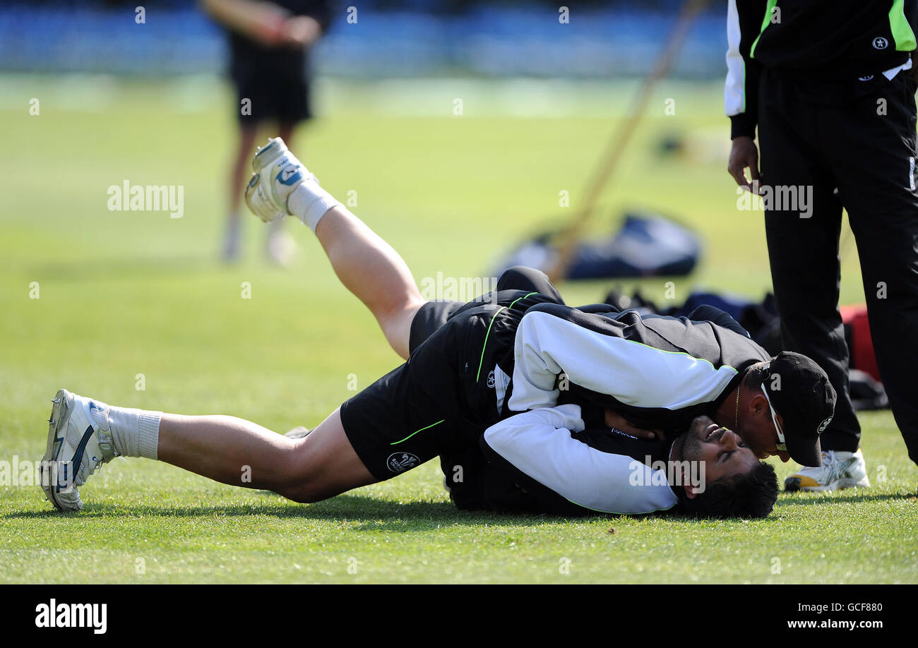Surrey's Andre Nel (top) and Usman Afzaal joke around during the warm up Stock Photo