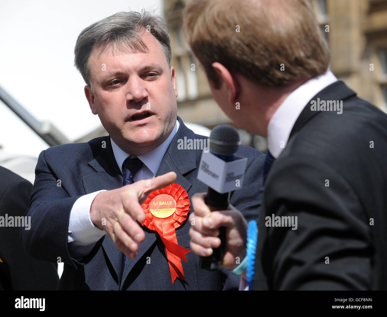 Ed Balls, Labour MP, in a discussion with Conservative candidate Antony