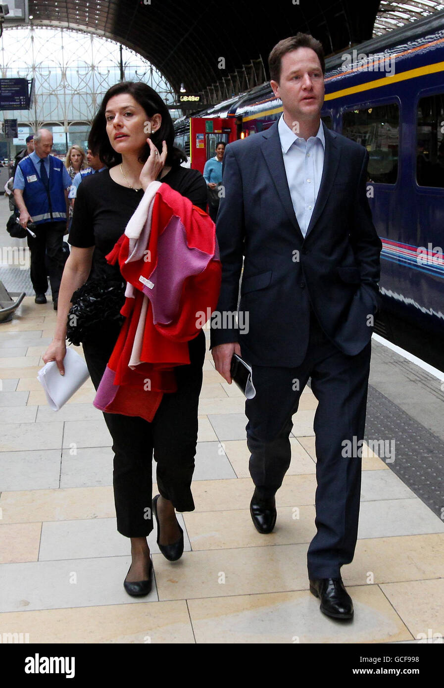 Liberal Democrat Leader Nick Clegg with his wife Miriam Gonzalez Durantez arrive at Paddington Station in London to board a train bound for a General Election Campaign visit to Wells. Stock Photo