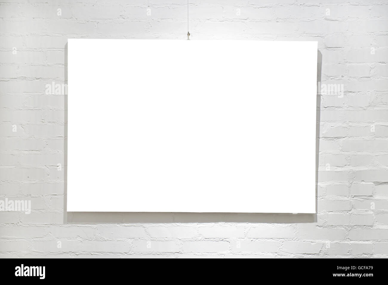 Modern empty frame on white brick wall. Gallery or exhibition interior Stock Photo