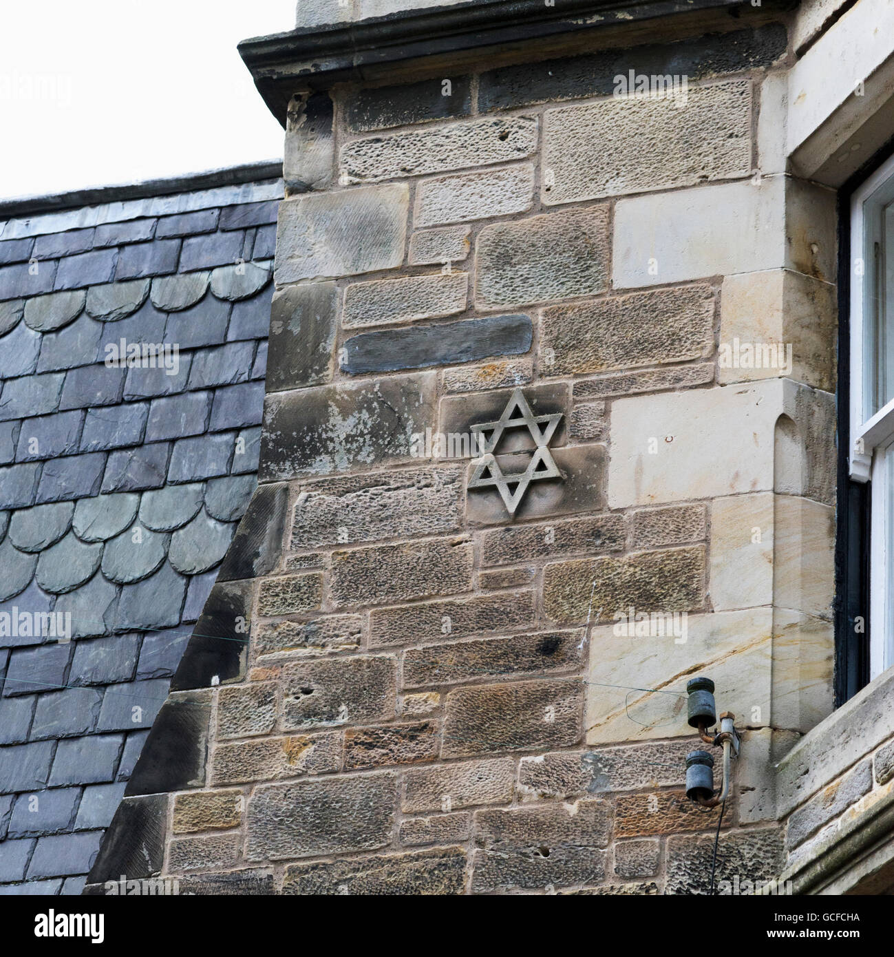 Star of David on the stone wall of a house; St. Andrews, Fife, Scotland Stock Photo
