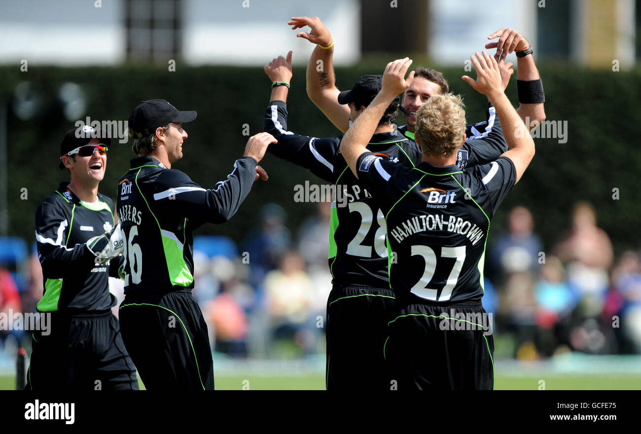 Surrey's players celebrate after taking Lancashire's first wicket. Stock Photo