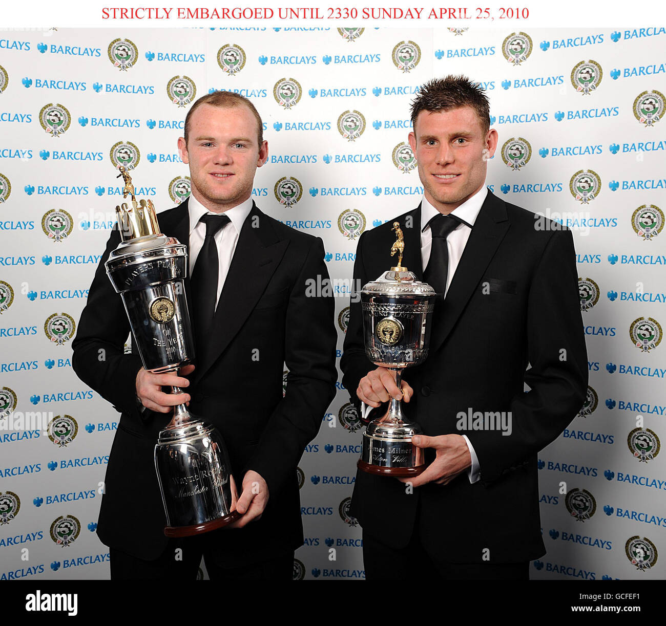 Manchester United's Wayne Rooney (left) with his trophy for PFA Players Player of the Year and Aston Villa's James Milner (right) with his trophy for Young Player of the Year, at the PFA Player of the Year Awards 2010 at the Grosvenor House Hotel, London. Stock Photo