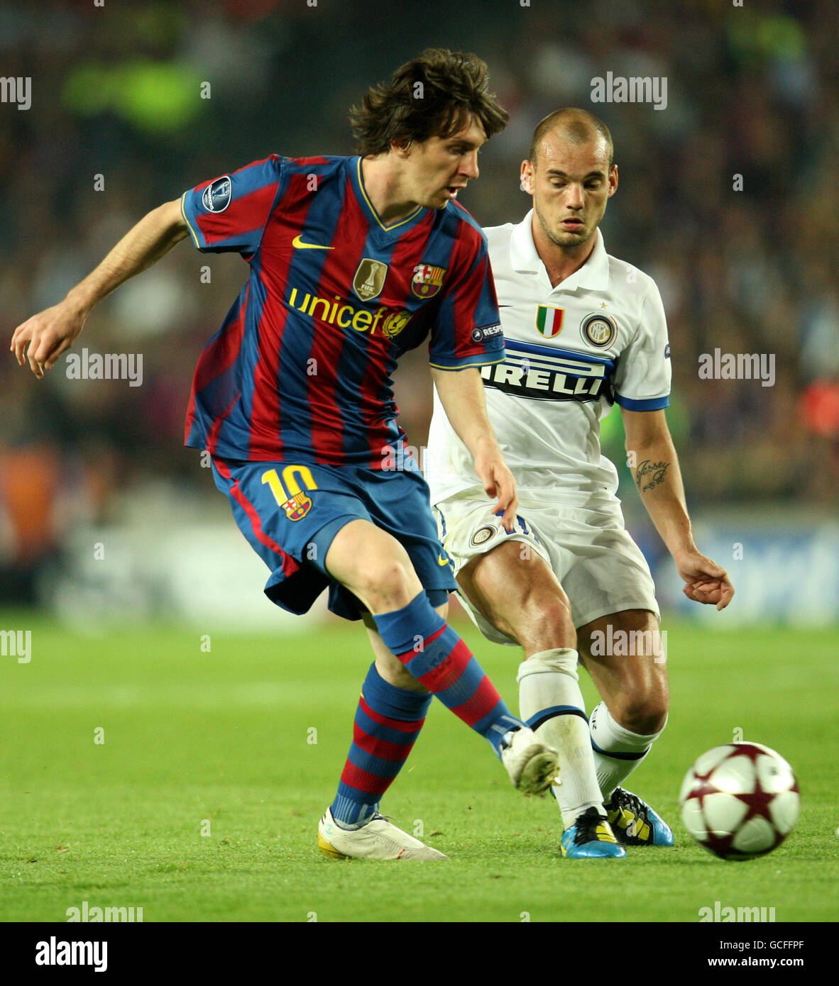 Barcelona's Lionel Messi and Inter Milan's Wesley Sneijder compete for the ball Stock Photo