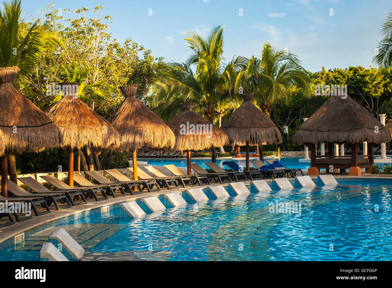 Swimming pool and lounge chairs at a resort on the Caribbean; Playa del Carmen, Quintana Roo