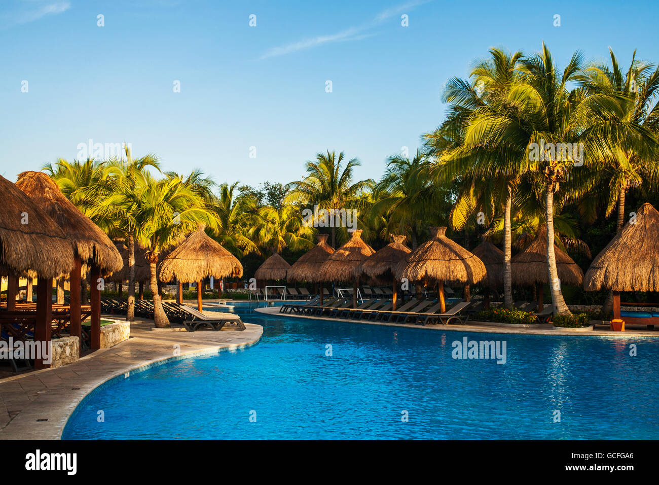 Swimming pool and lounge chairs at a resort on the Caribbean; Playa del Carmen, Quintana Roo
