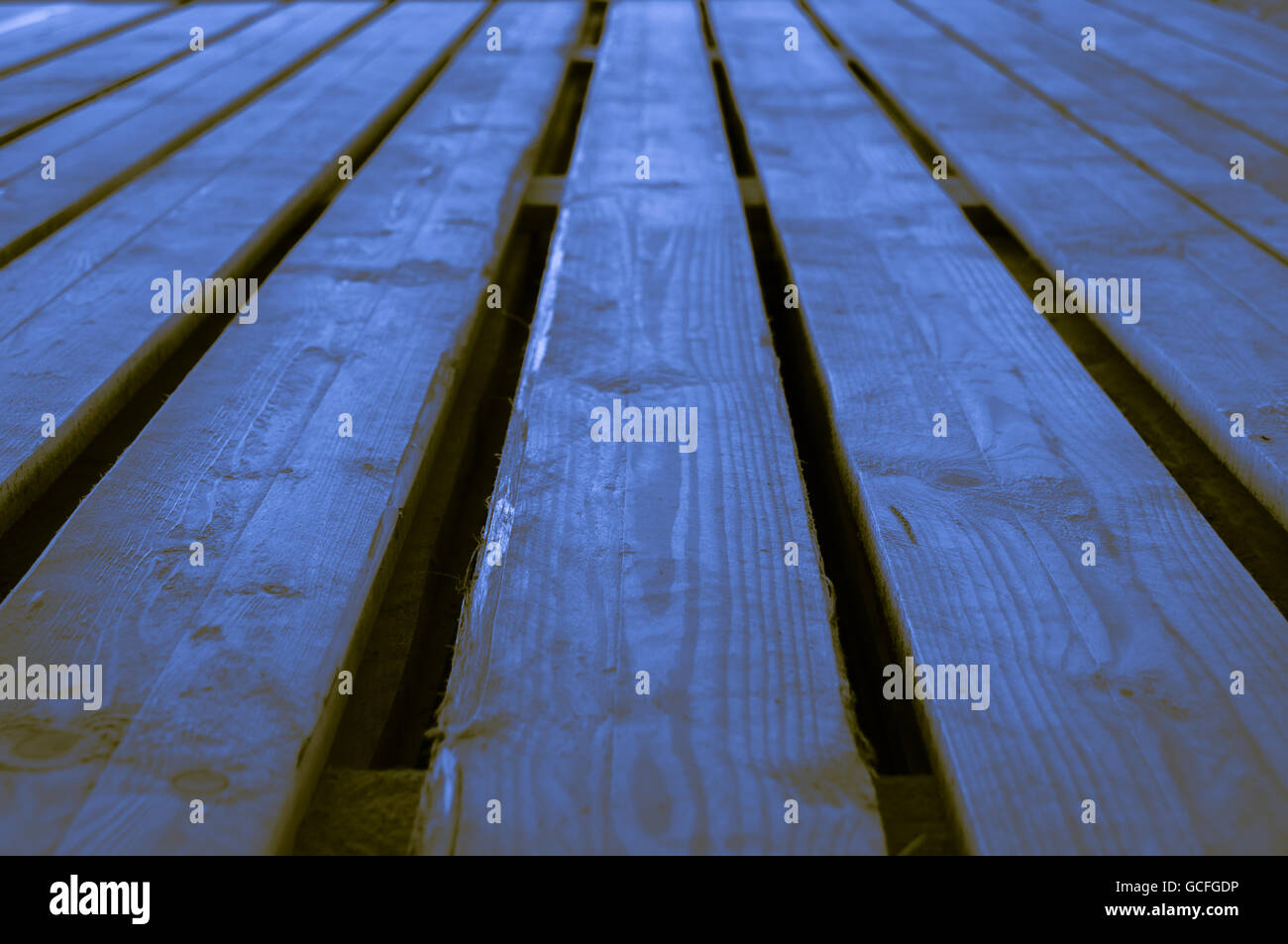 Rough blue yellowish brownish indigo wooden stage background with low depths of field Stock Photo