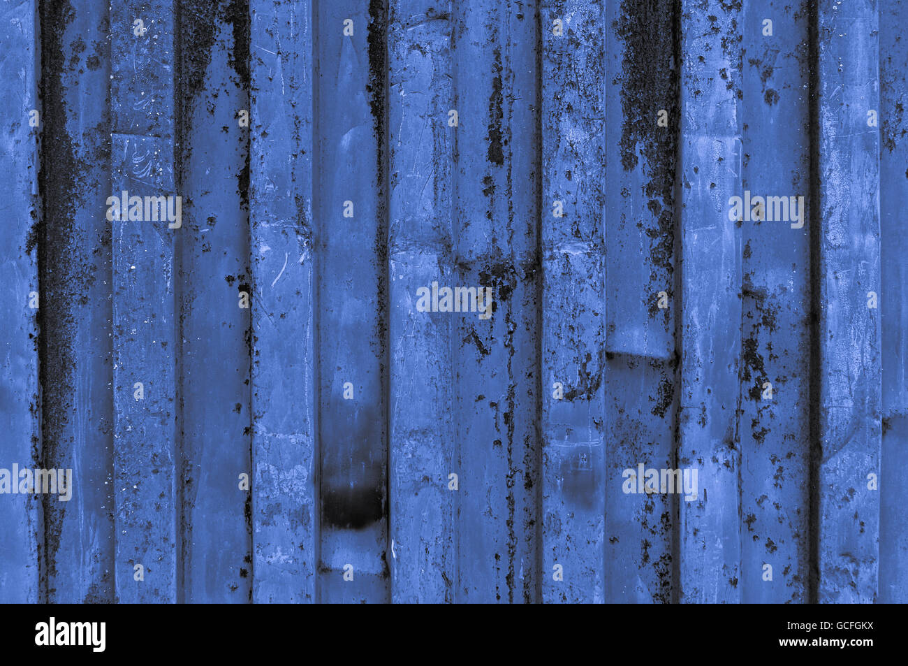 rough and rusty blue light grayish bluish indigo corrugated iron metal surface close-up Stock Photo
