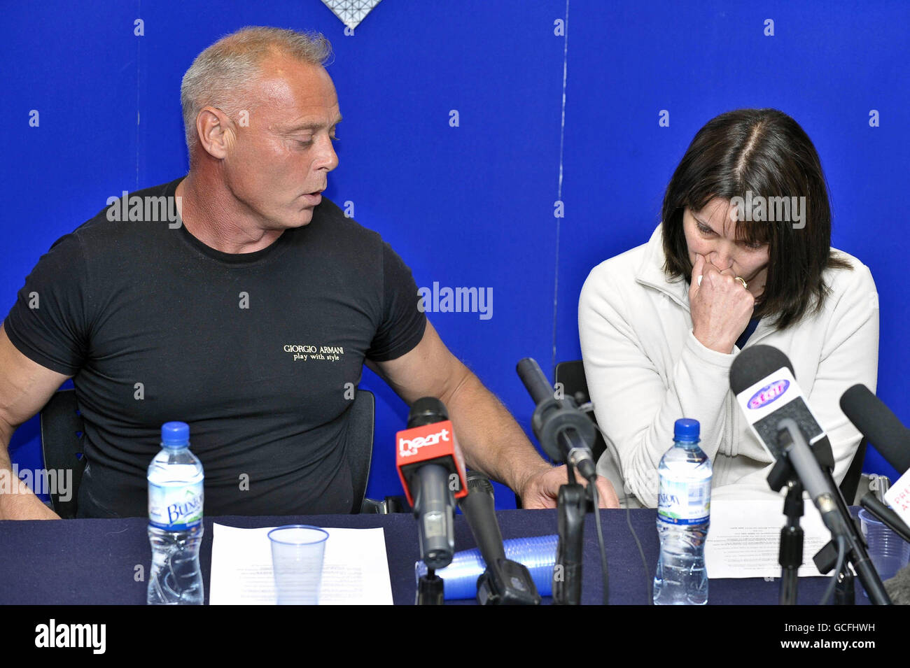 Philip and Julie Rubery, the son and daughter of Barry Rubery, 68, who had his legs and wrists bound by electrical cable and was beaten to death in his own home in the village of Iron Acton, South Gloucestershire, speak to the media during a press conference in Bristol. Stock Photo