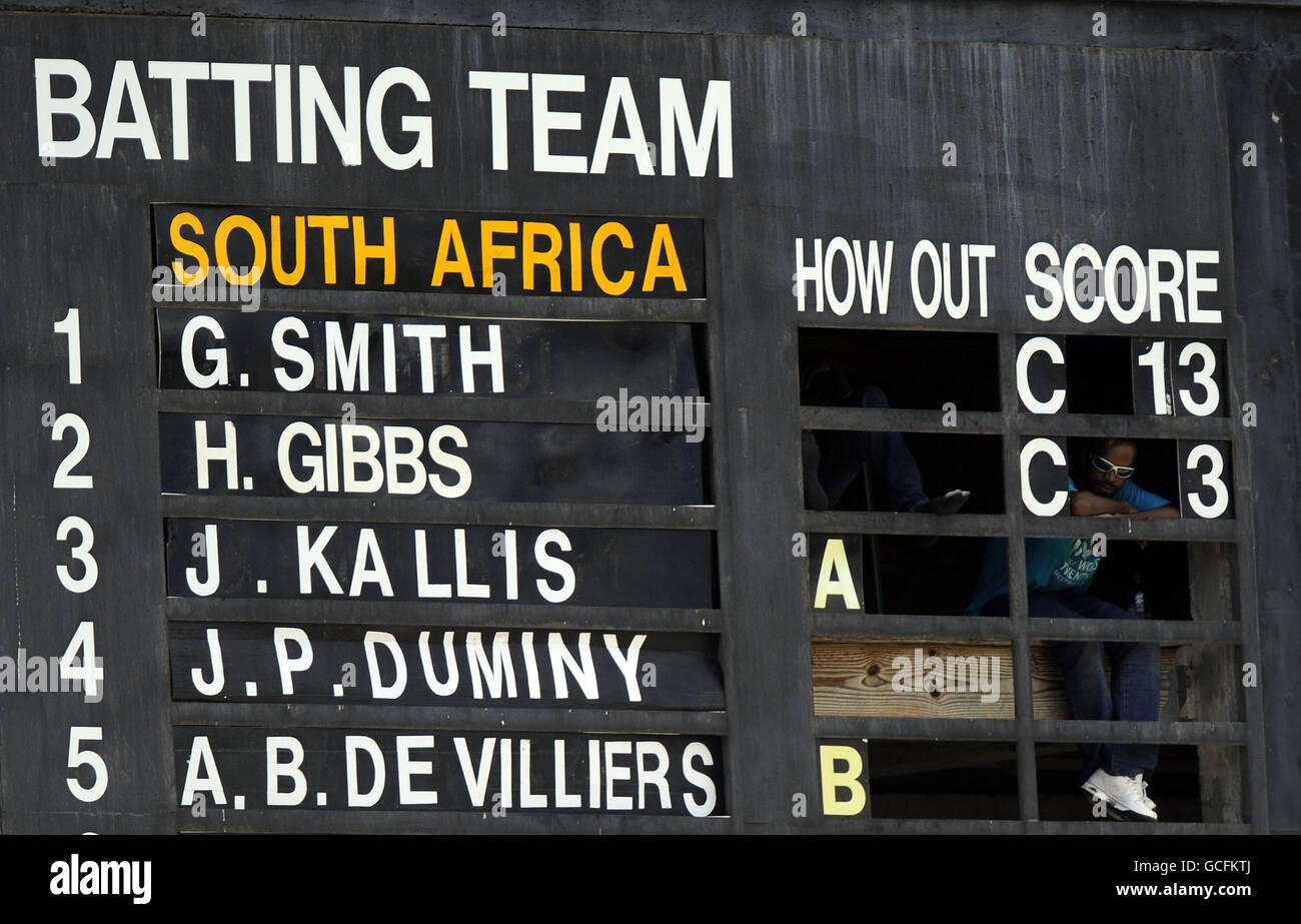 The manual scoreboard and scorer, during the Super Eights match at Beausejour Stadium, St Lucia. Stock Photo