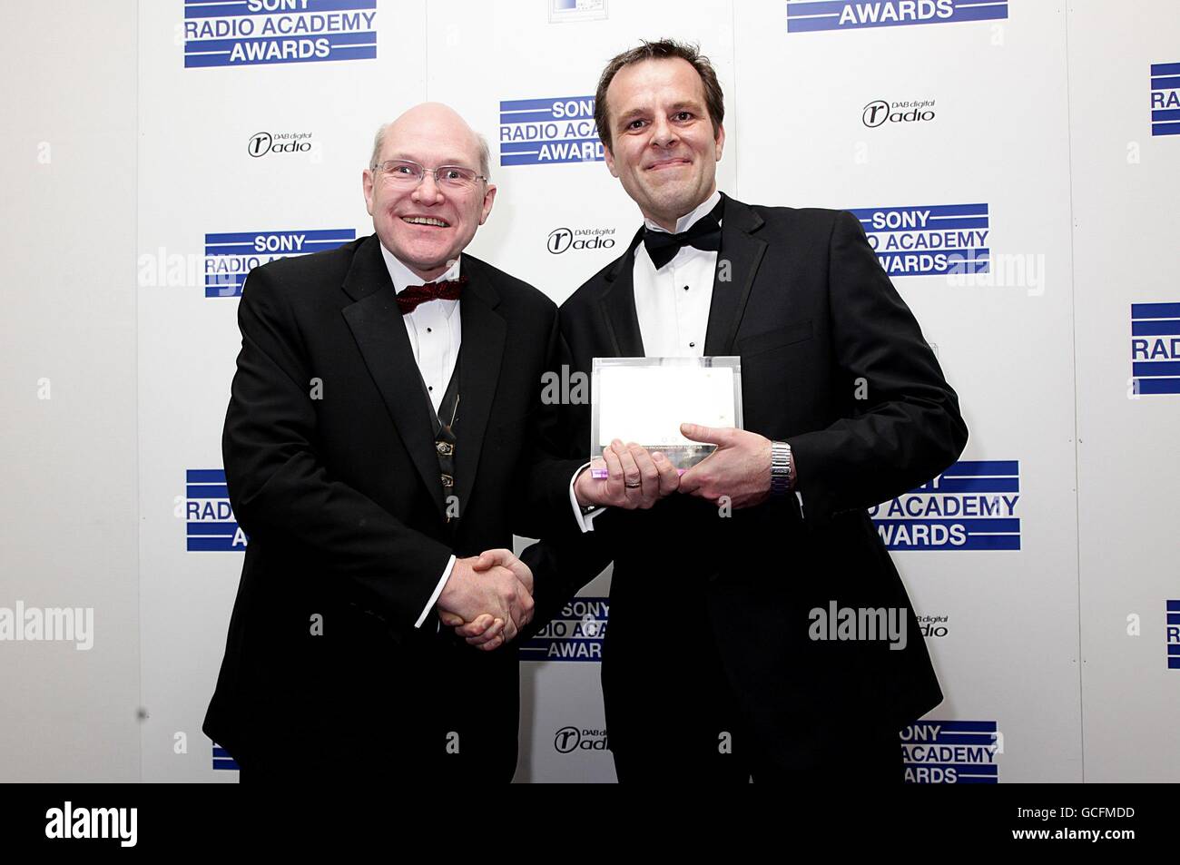 Trevor Dann (left) presents Euan McMorrow with the Station Programmer of the Year award at the Sony Radio Academy Awards 2010 at the Grosvenor House Hotel, London Stock Photo