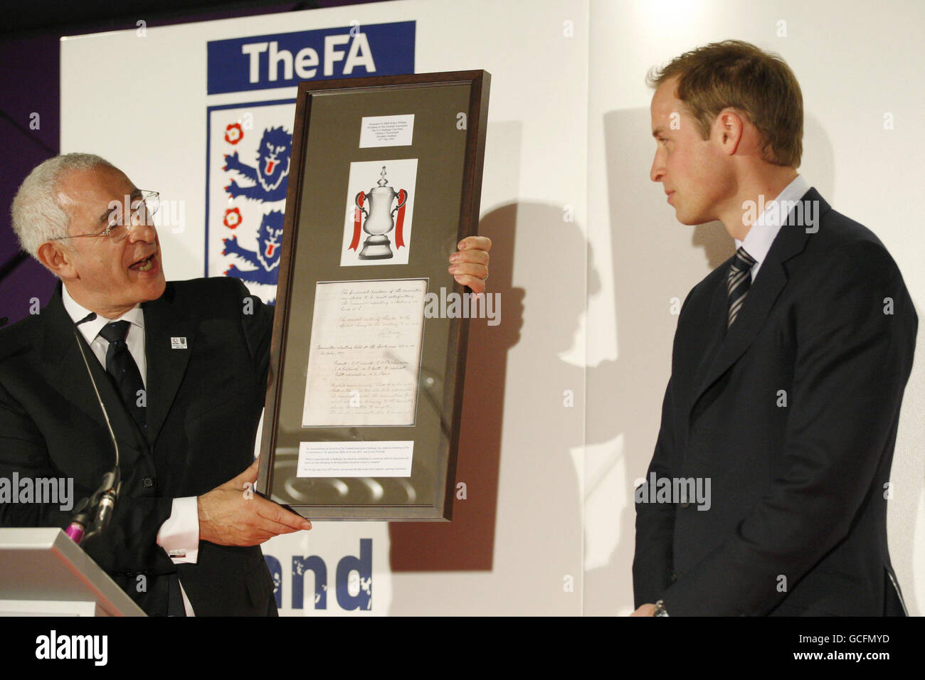 Chairman of FA, Lord Triesman, left, presents a gift to Prince William