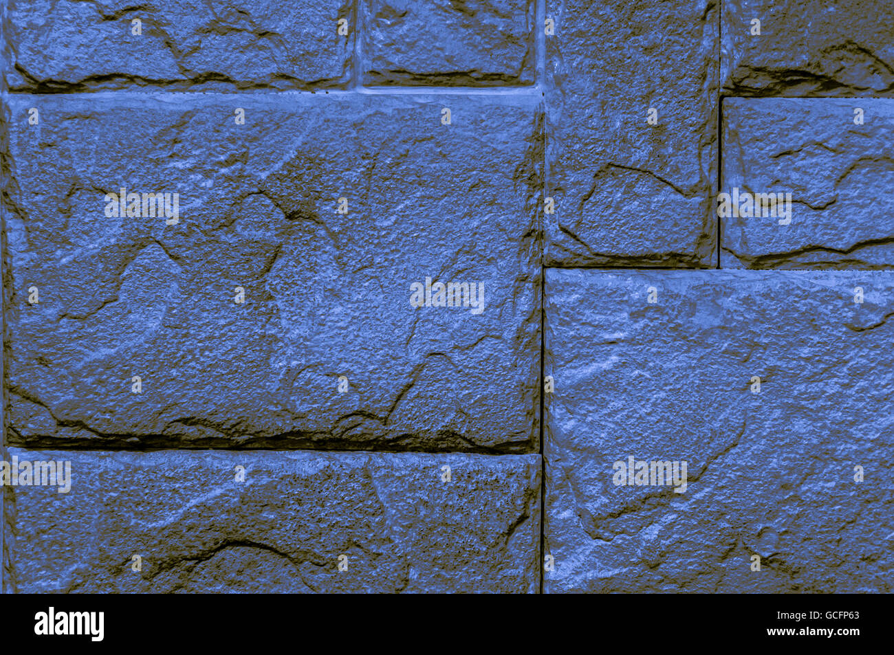 blue yellowish brownish indigo brick wall closeup Background Screen-saver Stock Photo