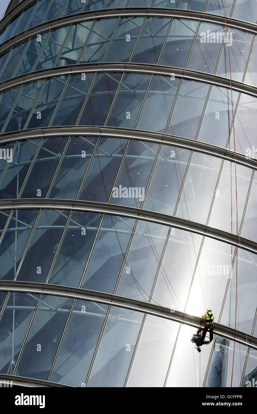 Electricians install strips of lighting to "The Convention