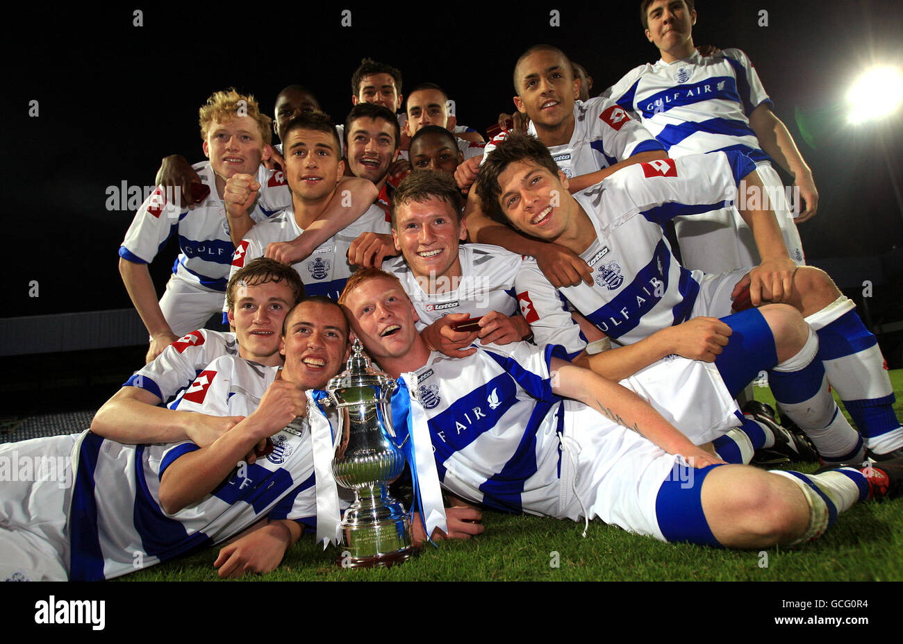 Full length trophy posing football hires stock photography and images