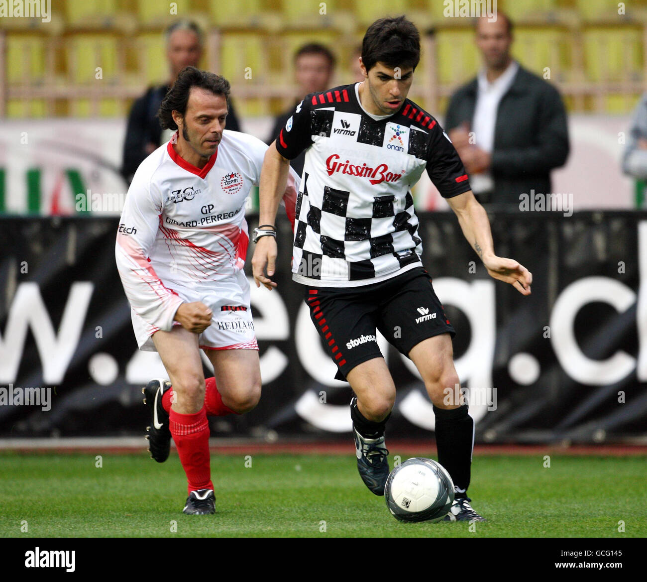 Soccer - Charity Match - Celebrity v Formula One Drivers - Stade Louis II. Jaime Alguersuari (right) in action during the Celebrity Charity Football match at Stade Louis II, Monaco. Stock Photo