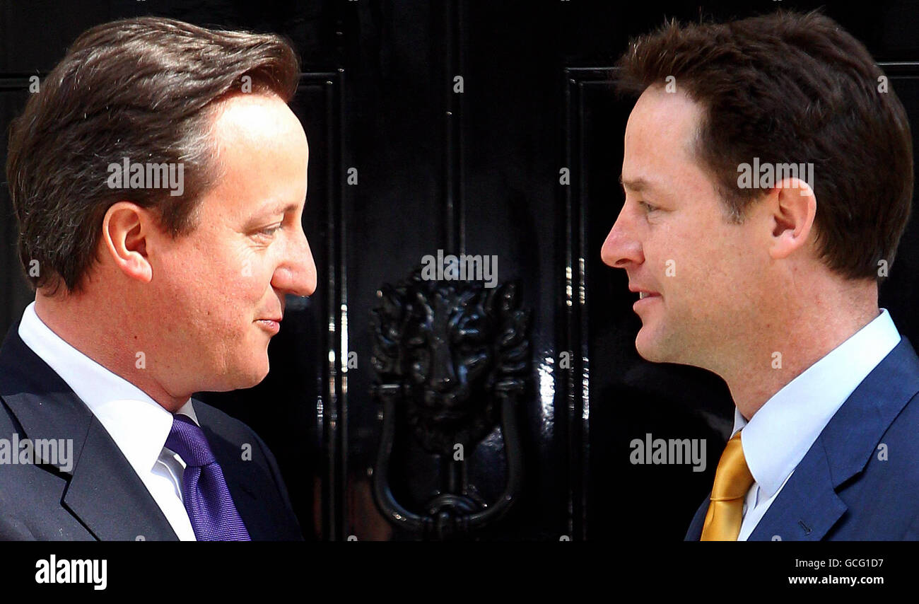The new British Prime Minister David Cameron (left) with the new Deputy Prime Minister Nick Clegg on the steps of 10 Downing Street in central London, before getting down to the business of running the country. Stock Photo