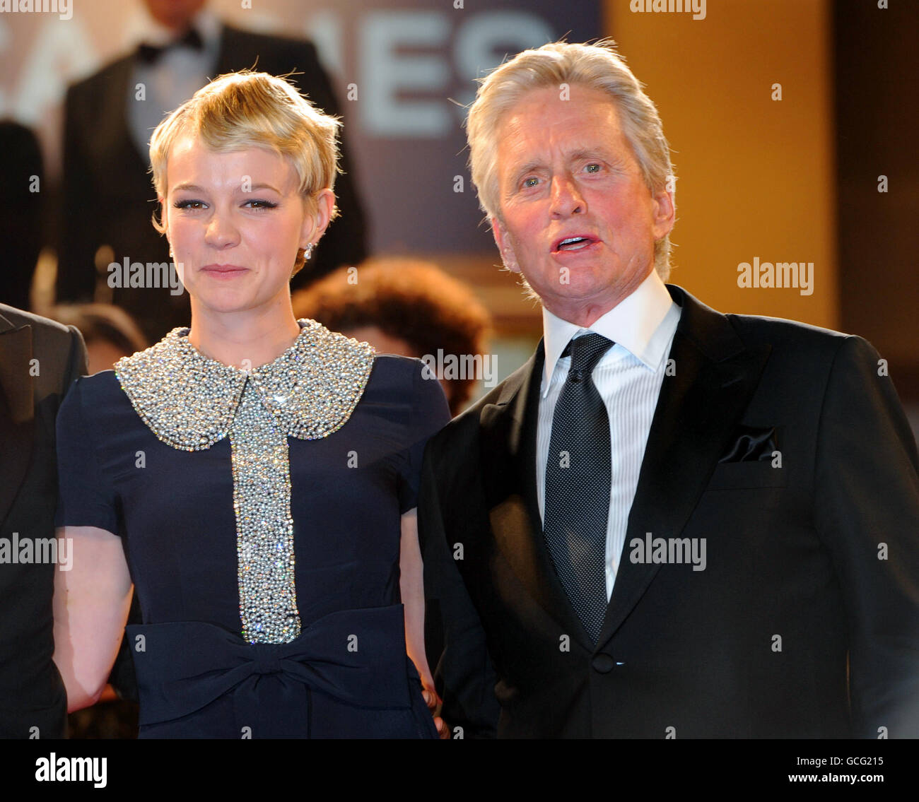 Carey Mulligan and Michael Douglas depart after the screening of Wall Street: Money Never Sleeps at the Grand Auditorium Lumiere during the Cannes Film Festival, France. Stock Photo