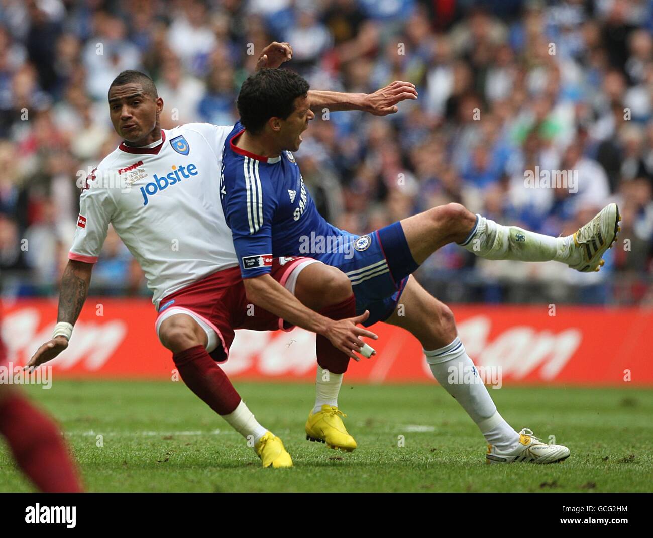 Soccer - FA Cup - Final - Chelsea v Portsmouth - Wembley Stadium. Portsmouth's Kevin-Prince Boateng (left) fouls Chelsea's Michael Ballack (right) for the ball Stock Photo