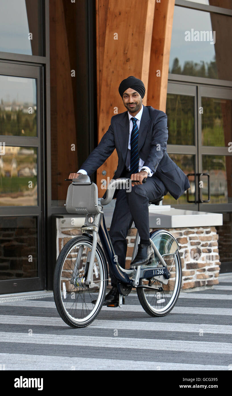 Kulveer Ranger, Transport Advisor to the Mayor of London, test rides a Devinci Cycle along the water front of the Saguenai Fjord at La Baie Saguenai, Canada. Stock Photo
