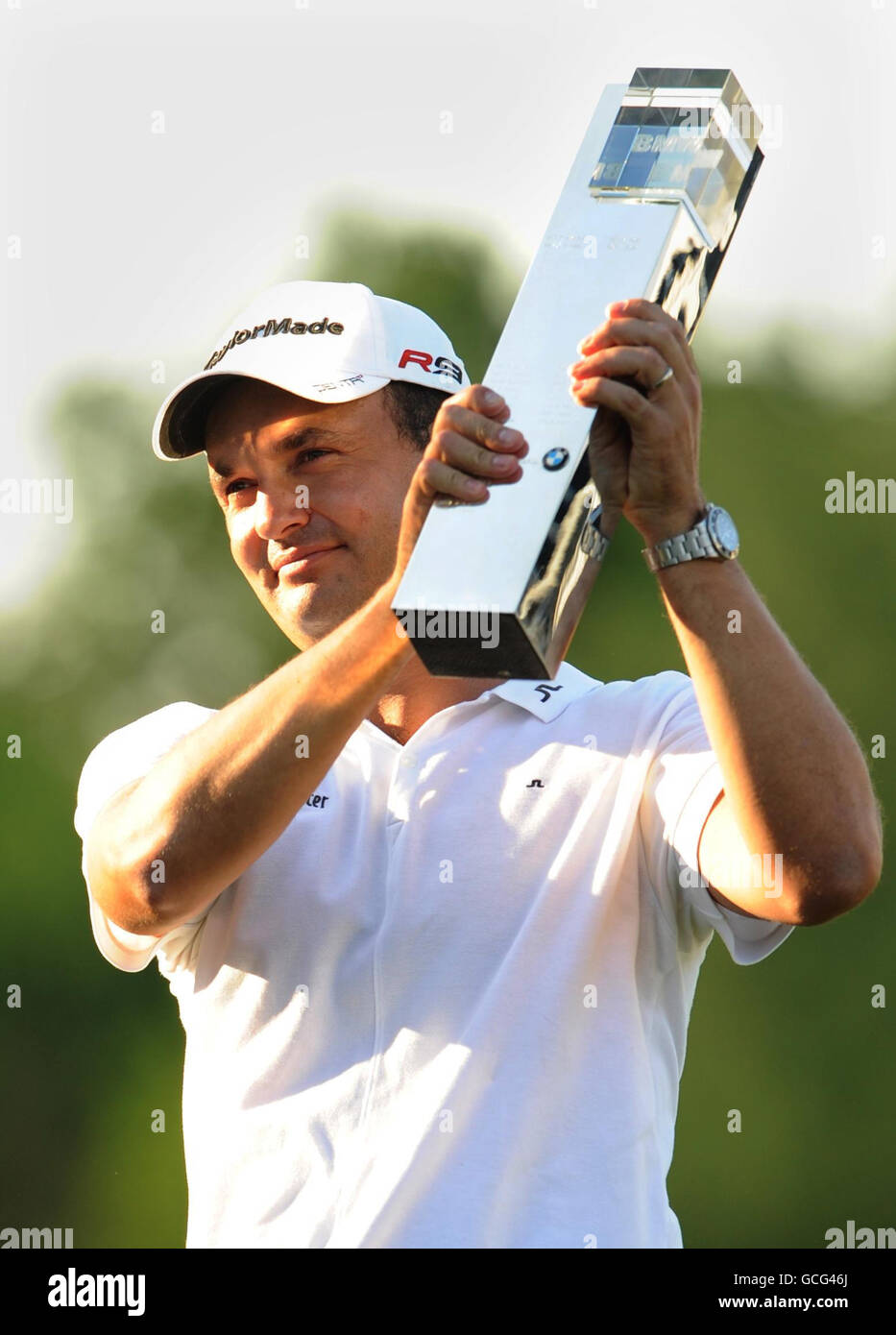 PGA Championship winner Simon Khan poses with the trophy following the BMW PGA Championship at Wentworth Golf Club, Surrey. Stock Photo